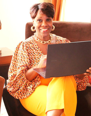 woman smiling with a laptop